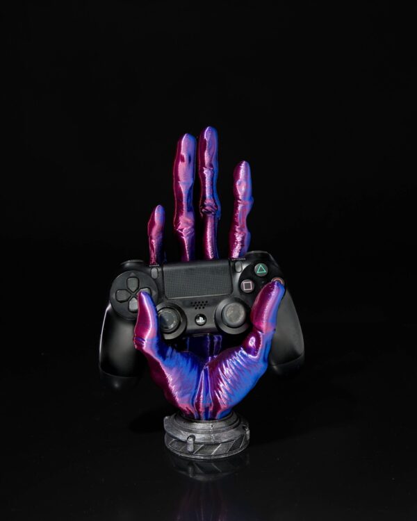 6-Finger Alien Hand Controller Holder with iridescent purple and blue hues, holding a black gaming controller against a dark background.