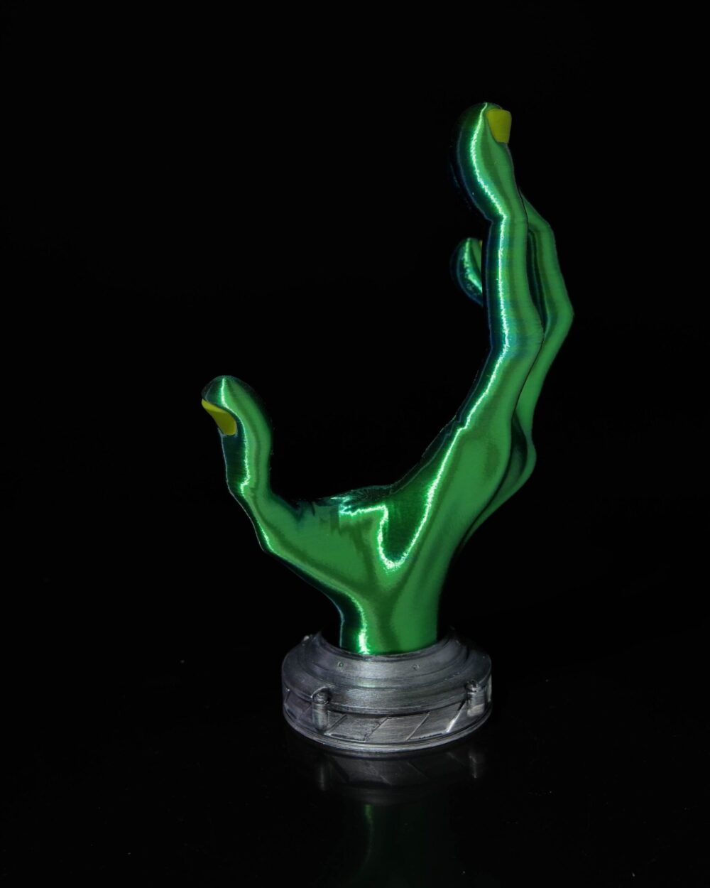 Green 4-Finger Alien Hand Controller Holder with metallic base on a black background. Perfect for gaming setups and display.