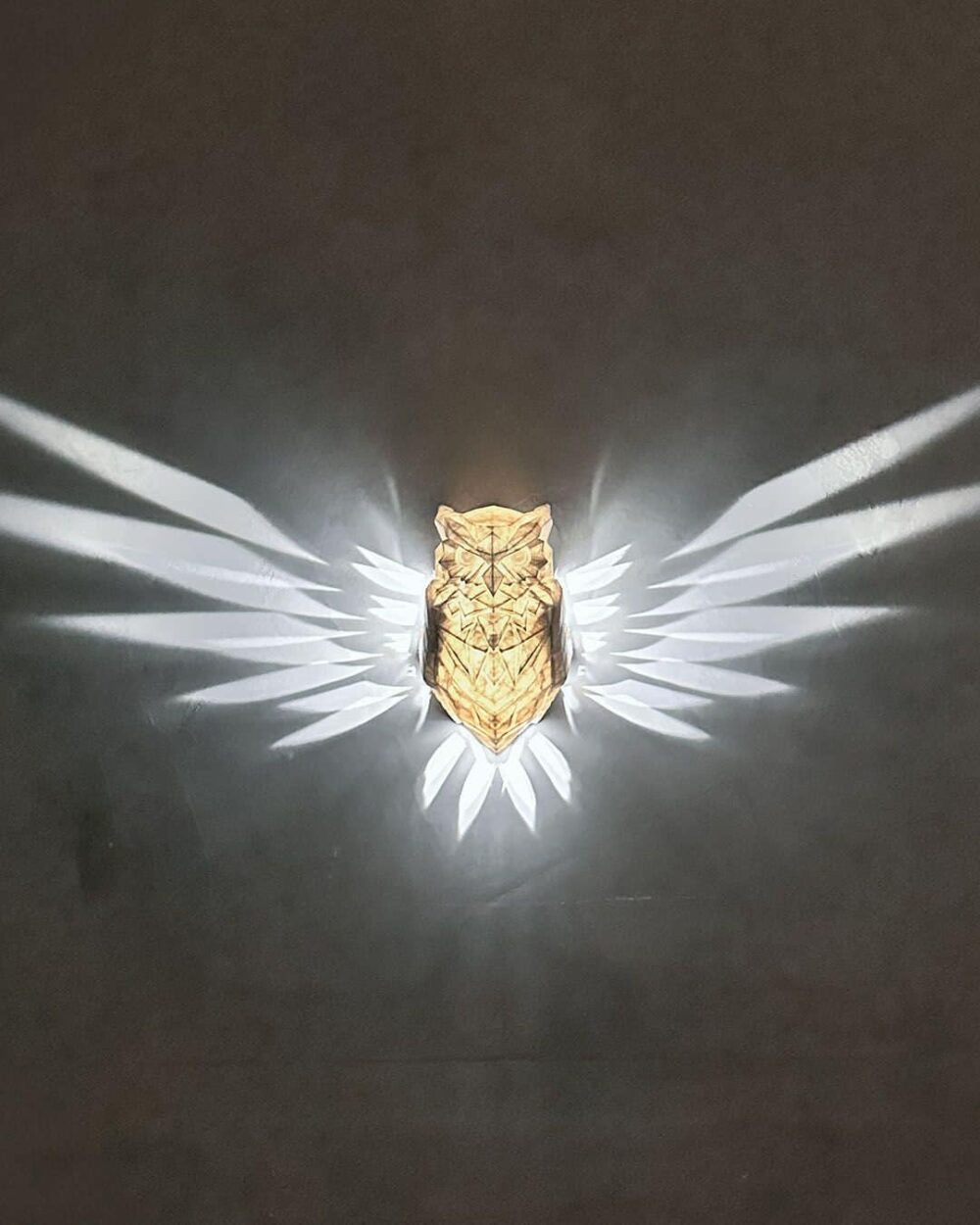 Enchanting Owl Night Light – Whimsical LED Wall Decor with an illuminated owl design casting ambient wing patterns in the dark.