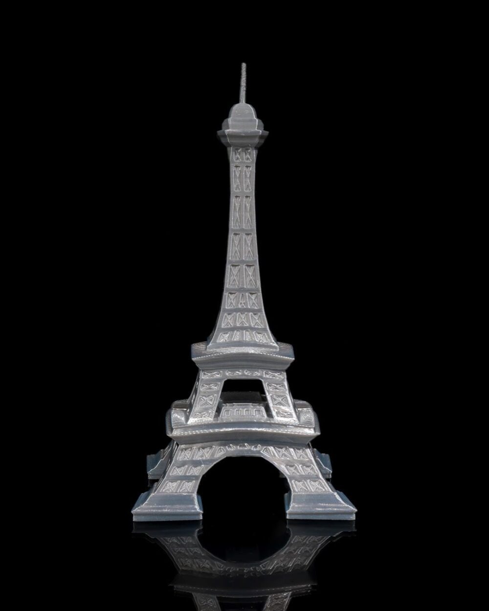 Eiffel Tower Home Decor Model - Parisian Art Sculpture for Living Room, Office, or Bedroom Decor against black background.