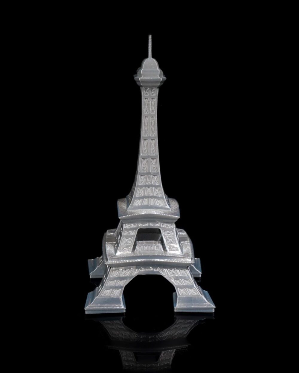 Eiffel Tower home decor model on a black background, ideal for living rooms, offices, or bedrooms. Parisian art sculpture.