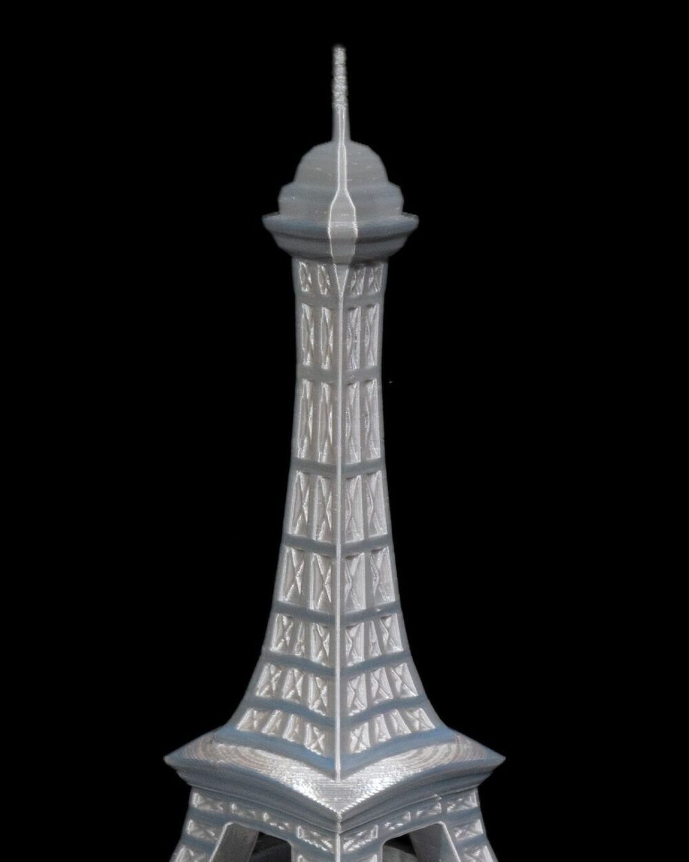 Eiffel Tower Home Decor Model in silver finish, detailed Parisian art sculpture for enhancing decor in living rooms or offices.