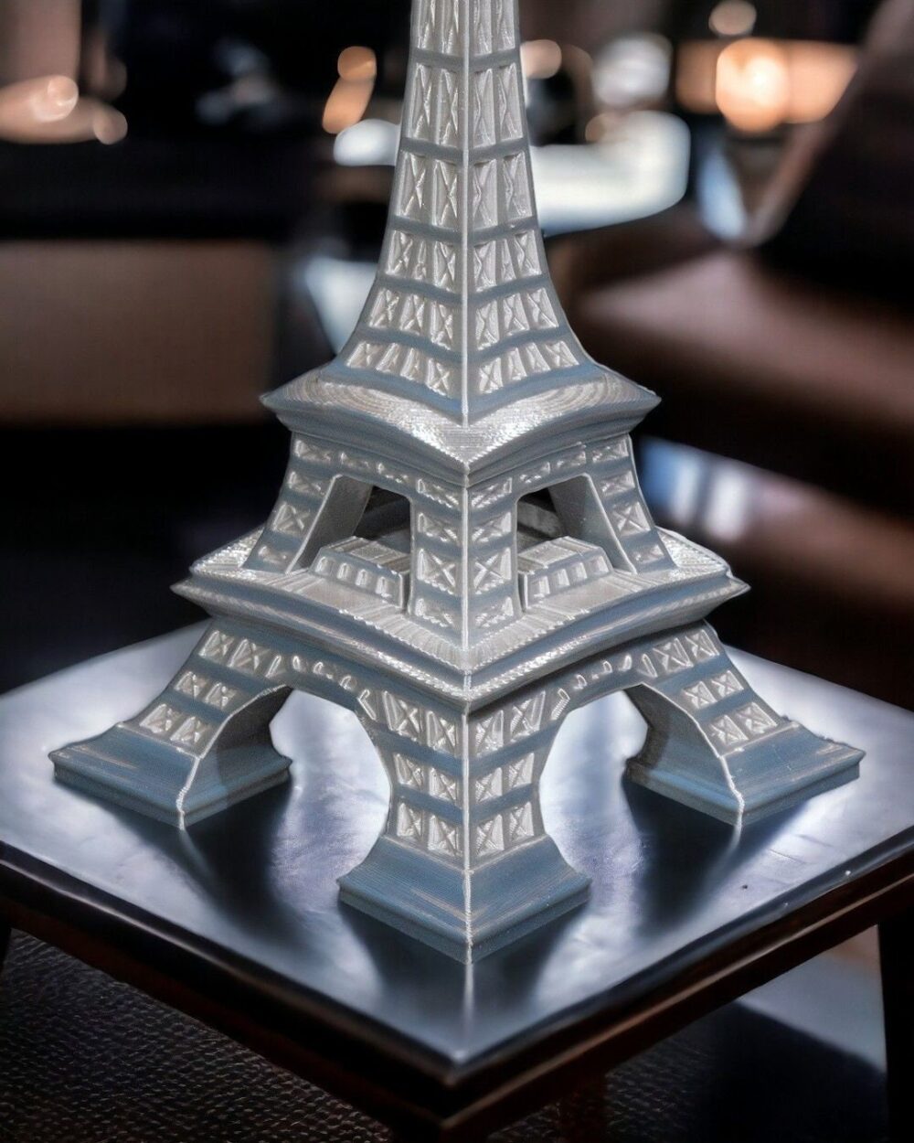 Eiffel Tower Home Decor Model displayed on a table, ideal for living room, office, or bedroom decoration. Intricate Parisian Art Sculpture.