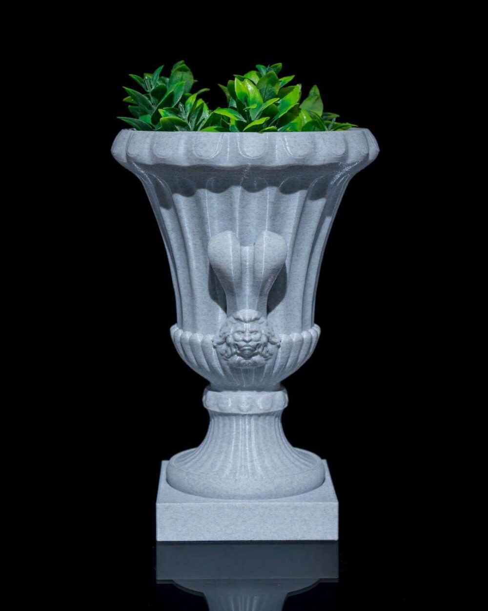 Elegant Roman Cup Planter for Home Decor, featuring antique Greco-Roman design with decorative lion head detail and lush green foliage.