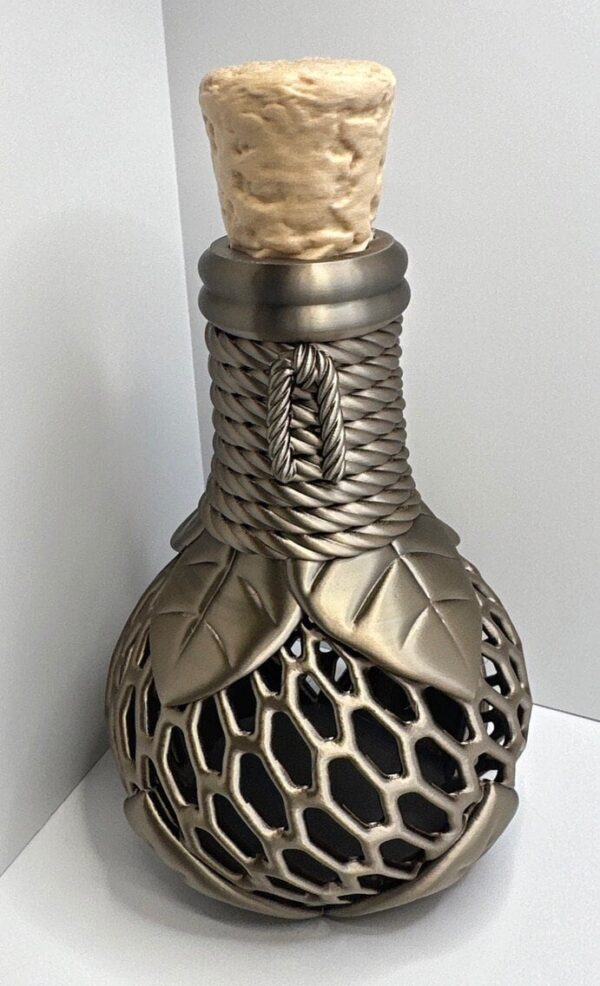 Decorative potion bottle vase with gothic design, detailed woven and leaf patterns, fantasy-themed home decor centerpiece.