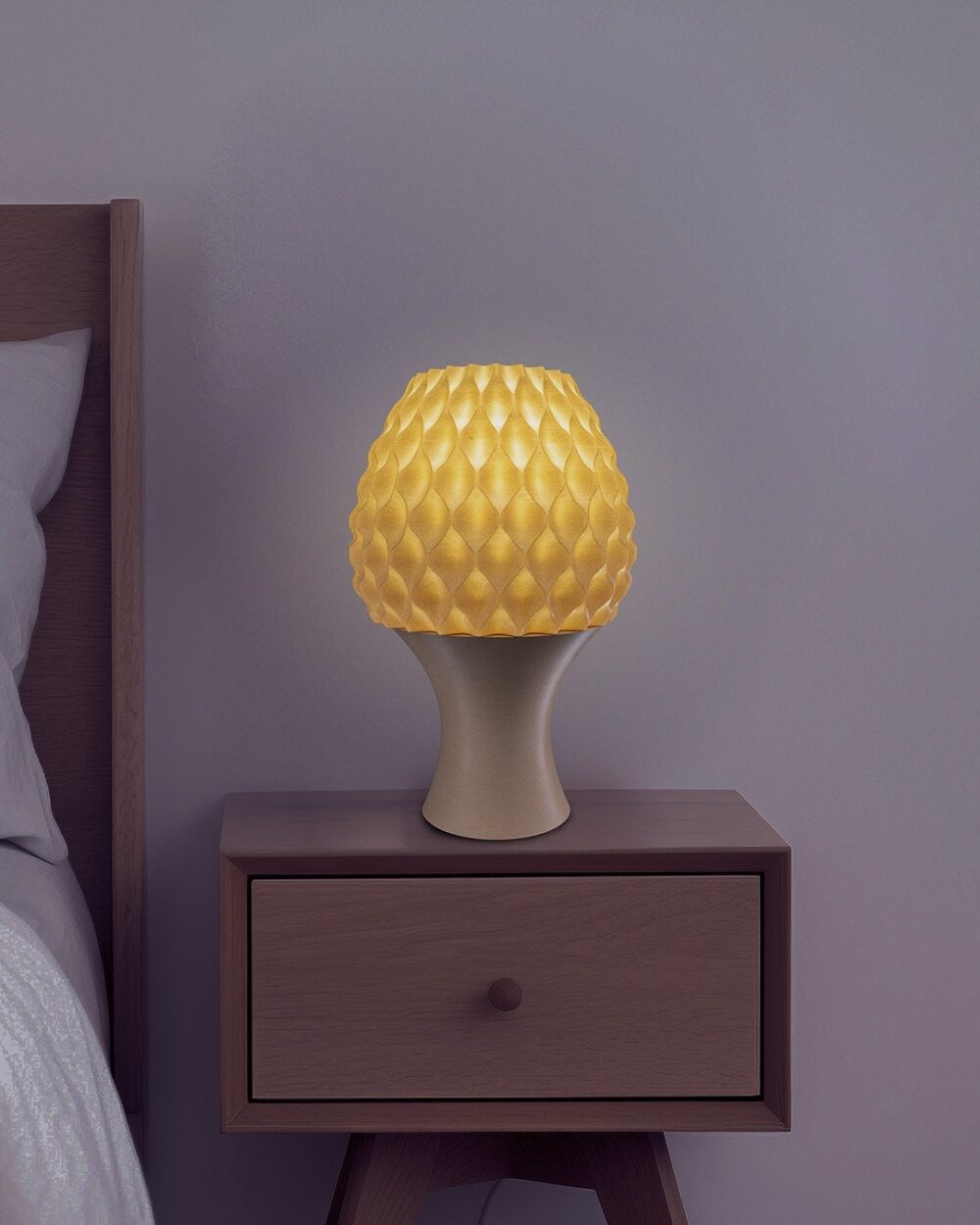 Reverse Diamond Table Lamp in yellow on wooden nightstand next to a bed. Modern and unique design for contemporary home lighting.